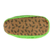 Alien slipper seen from the bottom, showing faux suede sole with non-slip grips