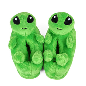 Pair of green alien slippers on a white background