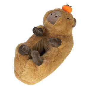 Capybara Slipper with feet, ears, brown plush, embroidered eyes and nostrils, and a citrus fruit balancing on its head, photo showing a 3/4 view