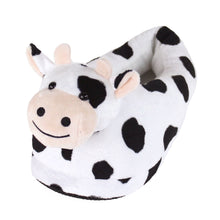 Plush cow-shaped slipper on a white background