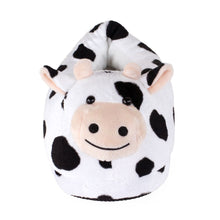 Plush cow slipper with black and white pattern on a white background