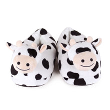 Pair of cow-themed slippers on a white background