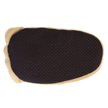 Plush slipper that looks like a big foot, positioned upside-down to show the sole, which is black fabric that has non-slip grips