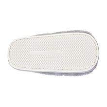 White slipper sole with textured pattern on a white background