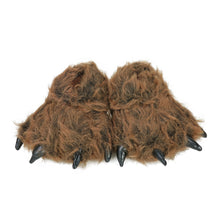 Pair of Kids Grizzly Paw Slippers, brown furry paw slippers with black claws on a white background