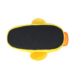 Yellow plush slipper shaped like a duck seen from the bottom showing black fabric footbed with non-slip grips